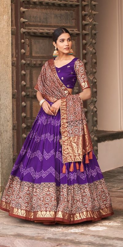 Glamorous Purple Color Tussar Silk Dot And Ajarakh Drawstring With Foil Printed Heavy Tassels Lehenga Choli e1708949199325