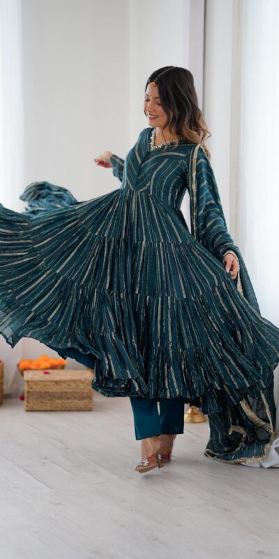 SRK 5305 Peacock Blue Color Mal Chanderi Gown with Mirror Work & Lace Work. Grab it for ₹2399. Delivery 4-6 Working Days. Shop now. | Bollywood Gowns, Creative Gowns, Designer Gowns, Embroidered Gowns, Gowns, Party Wear Gowns
