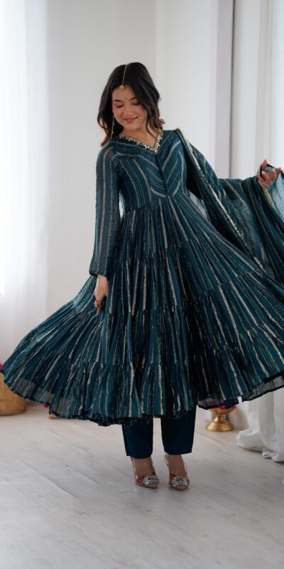 SRK 5305 Peacock Blue Color Mal Chanderi Gown with Mirror Work & Lace Work. Grab it for ₹2399. Delivery 4-6 Working Days. Shop now. | Bollywood Gowns, Creative Gowns, Designer Gowns, Embroidered Gowns, Gowns, Party Wear Gowns