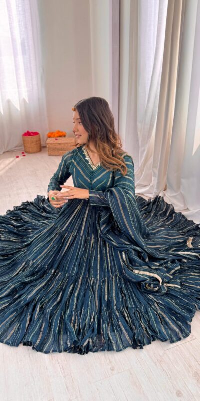 SRK 5305 Peacock Blue Color Mal Chanderi Gown with Mirror Work & Lace Work. Grab it for ₹2399. Delivery 4-6 Working Days. Shop now. | Bollywood Gowns, Creative Gowns, Designer Gowns, Embroidered Gowns, Gowns, Party Wear Gowns