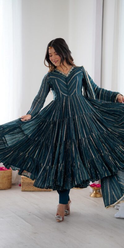 SRK 5305 Peacock Blue Color Mal Chanderi Gown with Mirror Work & Lace Work. Grab it for ₹2399. Delivery 4-6 Working Days. Shop now. | Bollywood Gowns, Creative Gowns, Designer Gowns, Embroidered Gowns, Gowns, Party Wear Gowns