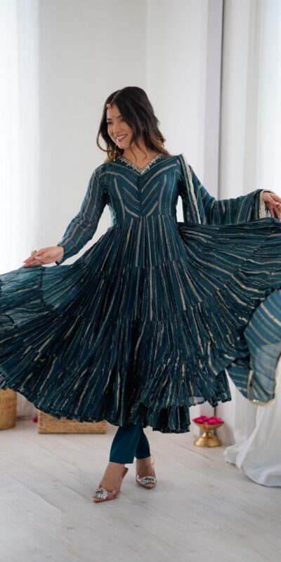 SRK 5305 Peacock Blue Color Mal Chanderi Gown with Mirror Work & Lace Work. Grab it for ₹2399. Delivery 4-6 Working Days. Shop now. | Bollywood Gowns, Creative Gowns, Designer Gowns, Embroidered Gowns, Gowns, Party Wear Gowns