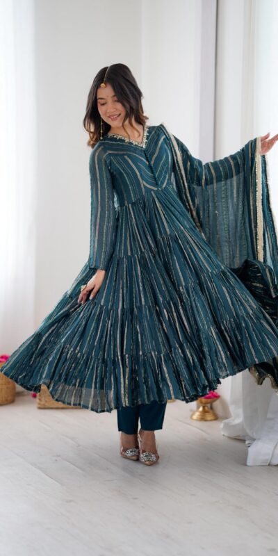 SRK 5305 Peacock Blue Color Mal Chanderi Gown with Mirror Work & Lace Work. Grab it for ₹2399. Delivery 4-6 Working Days. Shop now. | Bollywood Gowns, Creative Gowns, Designer Gowns, Embroidered Gowns, Gowns, Party Wear Gowns