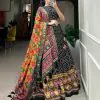 Angelic Black Color Tussar Silk With Heavy Tassels patola printed  Lehenga Choli