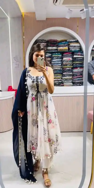 ZSR 3147 White Georgette Butti With Digital Print And Mirror Work Perfect for Wedding, Party, Engagement, Holi, Cultural Events 2099/- only | Bollywood Gowns, Creative Gowns, Designer Gowns, Embroidered Gowns, Gowns, Party Wear Gowns