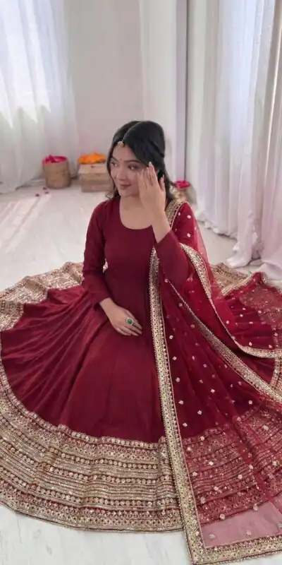 ZSR 3154 Maroon Roman Silk Gown with Embroidery Work & Lace Work. Grab it for ₹2449. Delivery 4-6 Working Days. Shop now. | Bollywood Gowns, Creative Gowns, Designer Gowns, Embroidered Gowns, Gowns, Party Wear Gowns