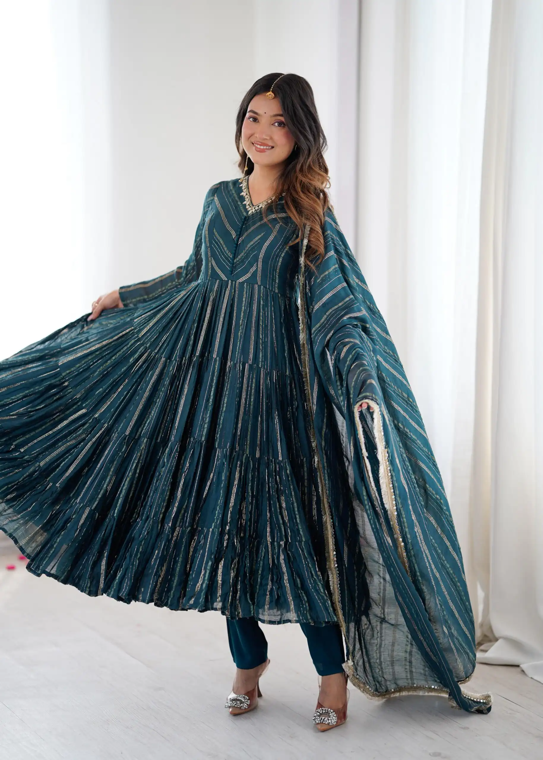 SRK 5305 Peacock Blue Color Mal Chanderi Gown with Mirror Work & Lace Work. Grab it for ₹2399. Delivery 4-6 Working Days. Shop now. | Bollywood Gowns, Creative Gowns, Designer Gowns, Embroidered Gowns, Gowns, Party Wear Gowns