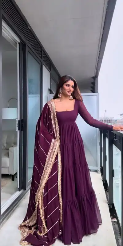 KD 1539 Wine Faux Georgette Ruffle Style Gown. Wedding, Party, Festive, Events Grab it for ₹2099. Delivery 4-6 Working Days. Shop now. | Bollywood Gowns, Creative Gowns, Designer Gowns, Embroidered Gowns, Gowns, Party Wear Gowns