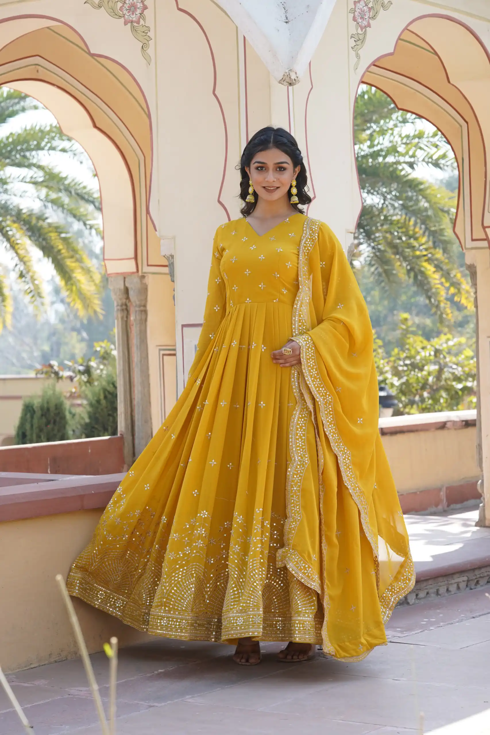 KA 1084 Yellow Faux Georgette Gown Perfect for Wedding, Party, Pooja, Festival Celebrations, Bridal Wear – . Festive Deal ₹2649. Delivery 4-6 Working | Bollywood Gowns, Creative Gowns, Designer Gowns, Embroidered Gowns, Gowns, Party Wear Gowns