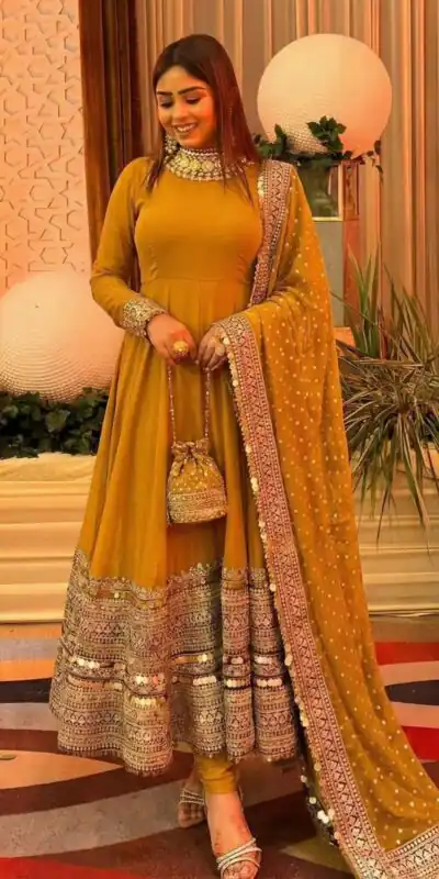 ZSR 3152 Mustered Color Roman silk Gown with Embroidery Work & Lace Work. Grab it for ₹2599. Delivery 4-6 Working Days. Shop now. | Bollywood Gowns, Creative Gowns, Designer Gowns, Embroidered Gowns, Gowns, Party Wear Gowns