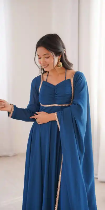 KB 291 Teal Color Fox Blooming Georgette Gown with Lace Work. Affordable Price ₹1899. Delivery 4-6 Working Days. Shop now. | Bollywood Gowns, Creative Gowns, Designer Gowns, Embroidered Gowns, Gowns, Party Wear Gowns