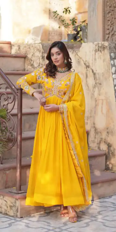 KA 1147 Yellow Faux Blooming Gown with Embroidery Work & Zari Work. Affordable Price ₹2049. Delivery 4-6 Working Days. Shop now. | Bollywood Gowns, Creative Gowns, Designer Gowns, Embroidered Gowns, Gowns, Party Wear Gowns