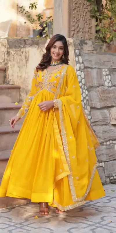 KA 1147 Yellow Faux Blooming Gown with Embroidery Work & Zari Work. Affordable Price ₹2049. Delivery 4-6 Working Days. Shop now. | Bollywood Gowns, Creative Gowns, Designer Gowns, Embroidered Gowns, Gowns, Party Wear Gowns
