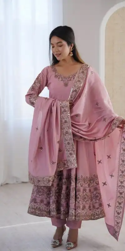 ZF 5016 Dusty Pink Roman Silk Gown with Embroidery Work. Wedding, Party, Festive, Events, Navratri, Offer ₹2499. Delivery 4-6 Working Days. Shop now. | Bollywood Gowns, Creative Gowns, Designer Gowns, Embroidered Gowns, Gowns, Party Wear Gowns