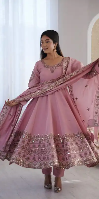 ZF 5016 Dusty Pink Roman Silk Gown with Embroidery Work. Wedding, Party, Festive, Events, Navratri, Offer ₹2499. Delivery 4-6 Working Days. Shop now. | Bollywood Gowns, Creative Gowns, Designer Gowns, Embroidered Gowns, Gowns, Party Wear Gowns