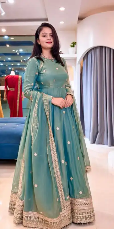 SSR 553 Teal Fendy Silk Gown with Sequins Work & Thread Embroidery. Now at just ₹2399. Delivery 4-6 Working Days. Shop now. | Bollywood Gowns, Creative Gowns, Designer Gowns, Embroidered Gowns, Gowns, Party Wear Gowns