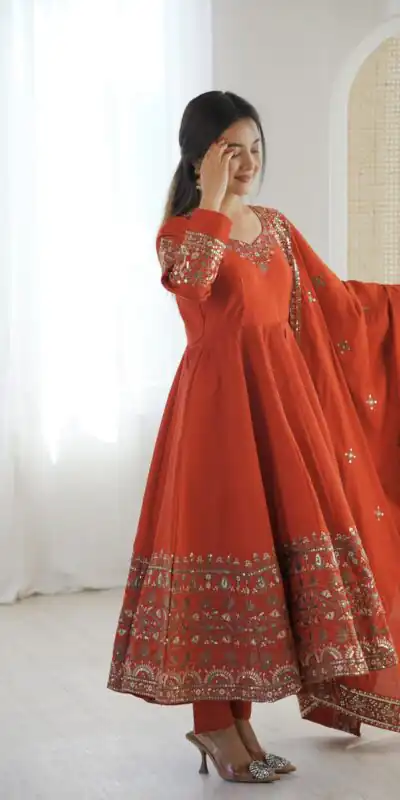 ZF 5016 Orange Roman Silk Gown with Embroidery Work. Wedding, Party, Festive, Events, Navratri, Exclusive Offer ₹2499. Delivery 4-6 Working Days. Shop now. | Bollywood Gowns, Creative Gowns, Designer Gowns, Embroidered Gowns, Gowns, Party Wear Gowns