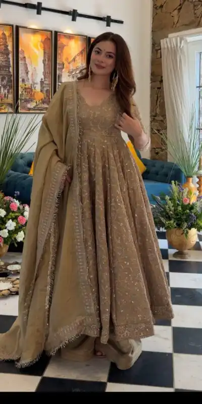 SR 1726 Chiku Fendy Silk Gown with Embroidery Work & Sequins Work. Special Price ₹2899. Delivery 4-6 Working Days. Shop now. | Bollywood Gowns, Creative Gowns, Designer Gowns, Embroidered Gowns, Gowns, Party Wear Gowns