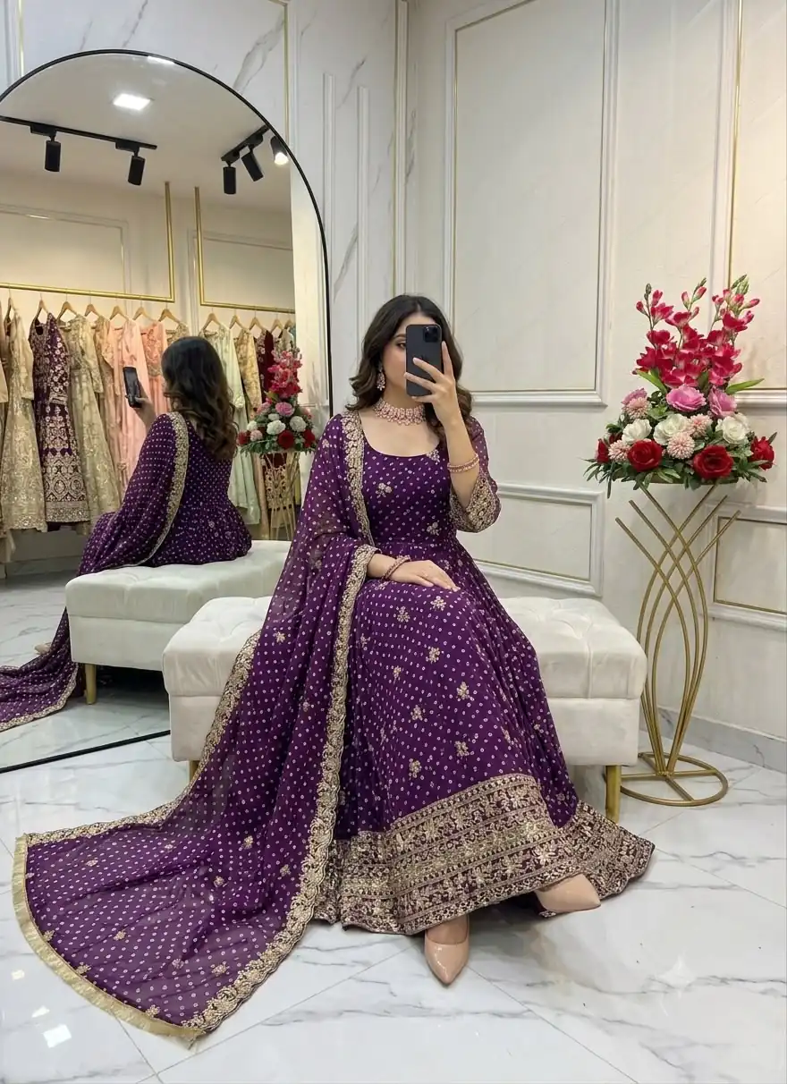 WW 1283 Wine in Colour Faux Georgette Bandhani Print Work Gown. Available at ₹2399 only. Delivery 4-6 Working Days. Shop now. | Bollywood Gowns, Creative Gowns, Designer Gowns, Embroidered Gowns, Gowns, Party Wear Gowns