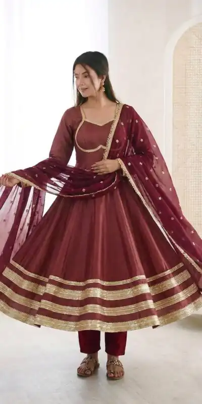 ZF 5017 Maroon Color Cosmos Gold Gown with Embroidery Work & Lace Work. Get it for ₹2099. Delivery 4-6 Working Days. Shop now. | Bollywood Gowns, Creative Gowns, Designer Gowns, Embroidered Gowns, Gowns, Party Wear Gowns
