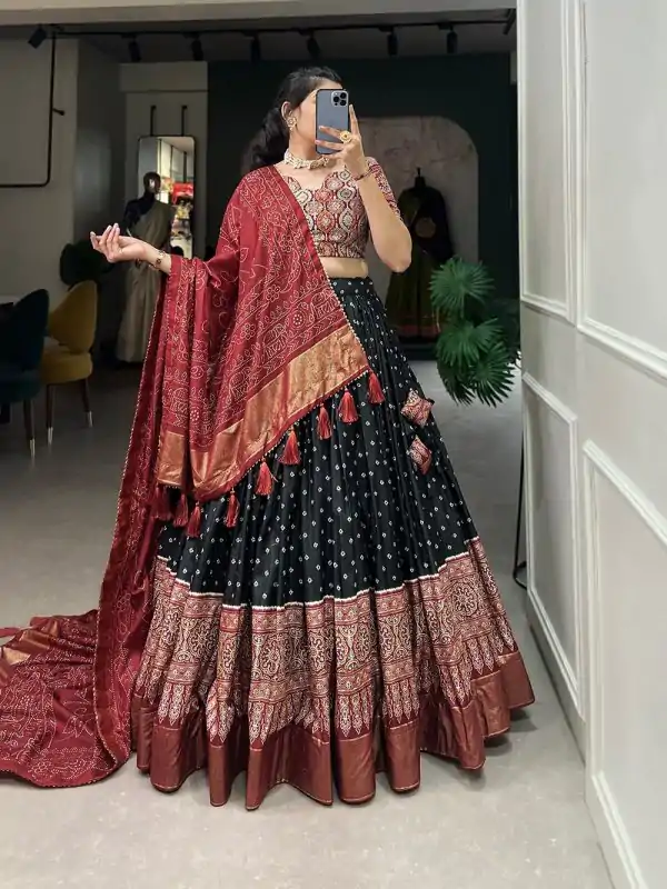 Stylish Black Color Tussar Patola Print Foil Work Lehenga Choli