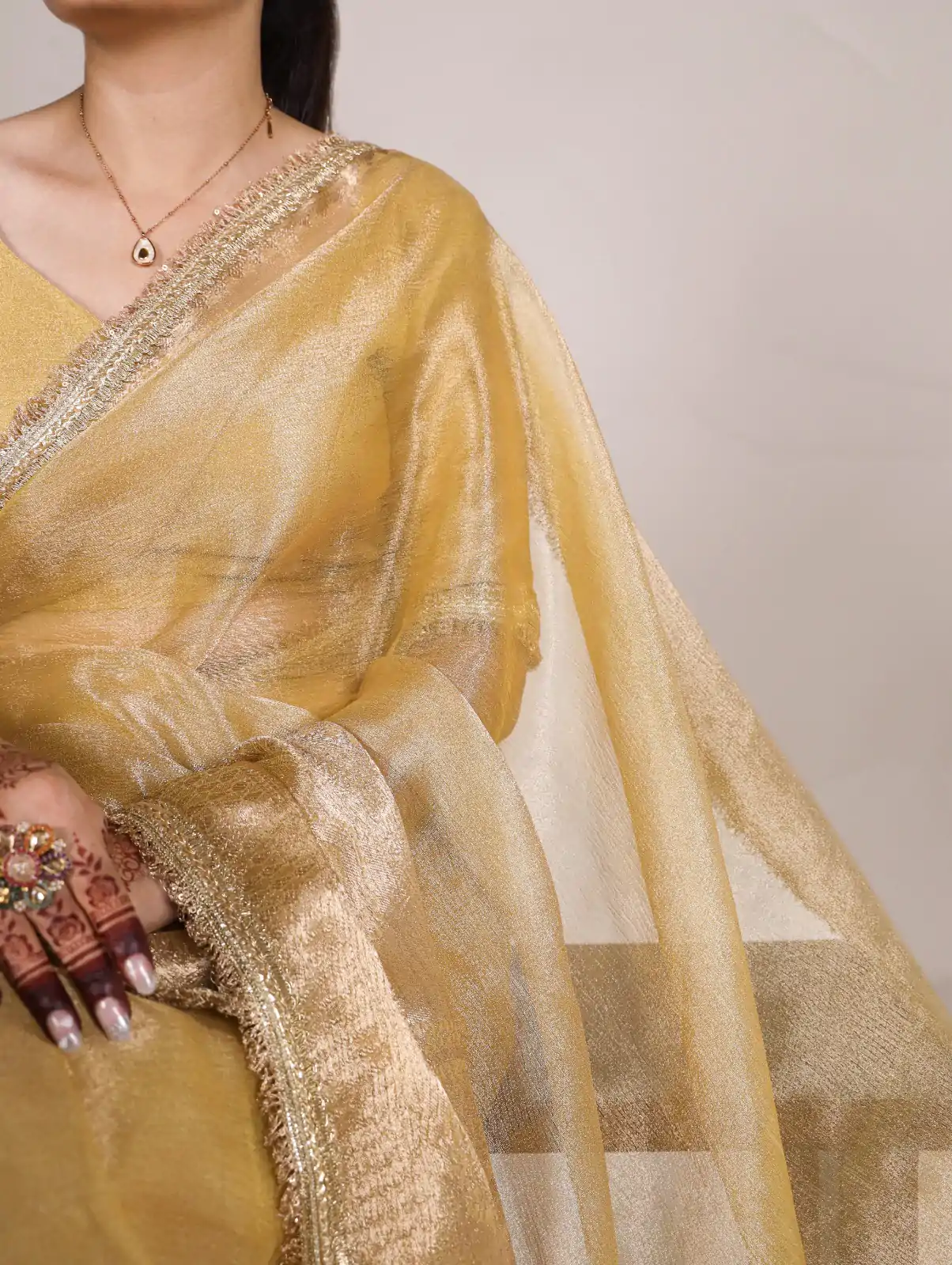 Attractive Gold Color Tissue Shimmer Zari Weaving Work Saree - Image 2